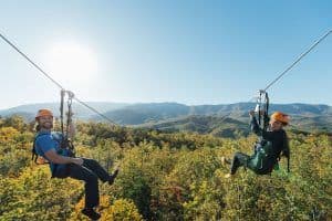 people ziplining in the smoky mountains