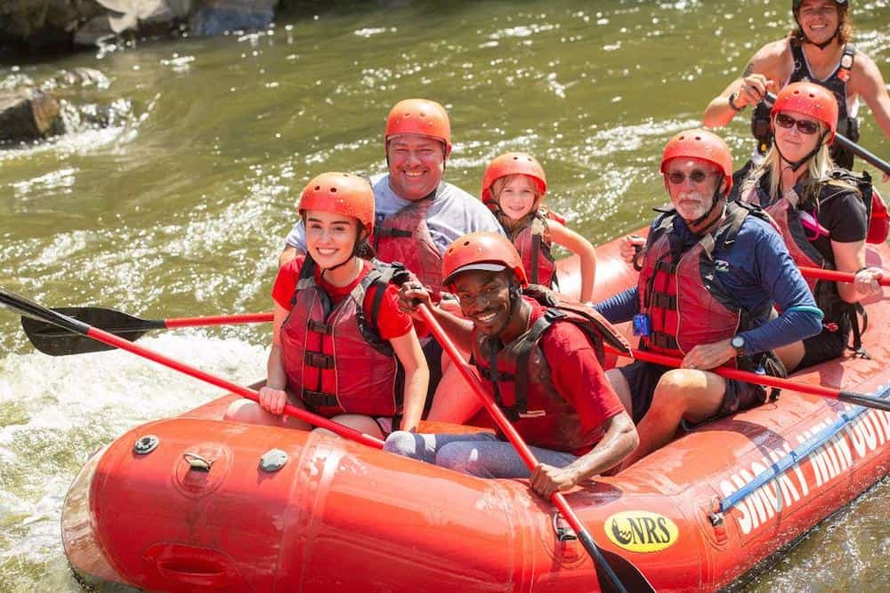 smiling people rafting