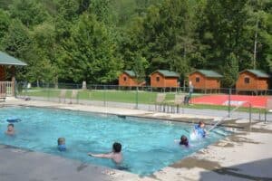 outdoor pool and jumping pillow at Pigeon River Campground