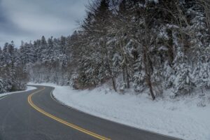 winding road in the Smoky Mountains surrounded by snow
